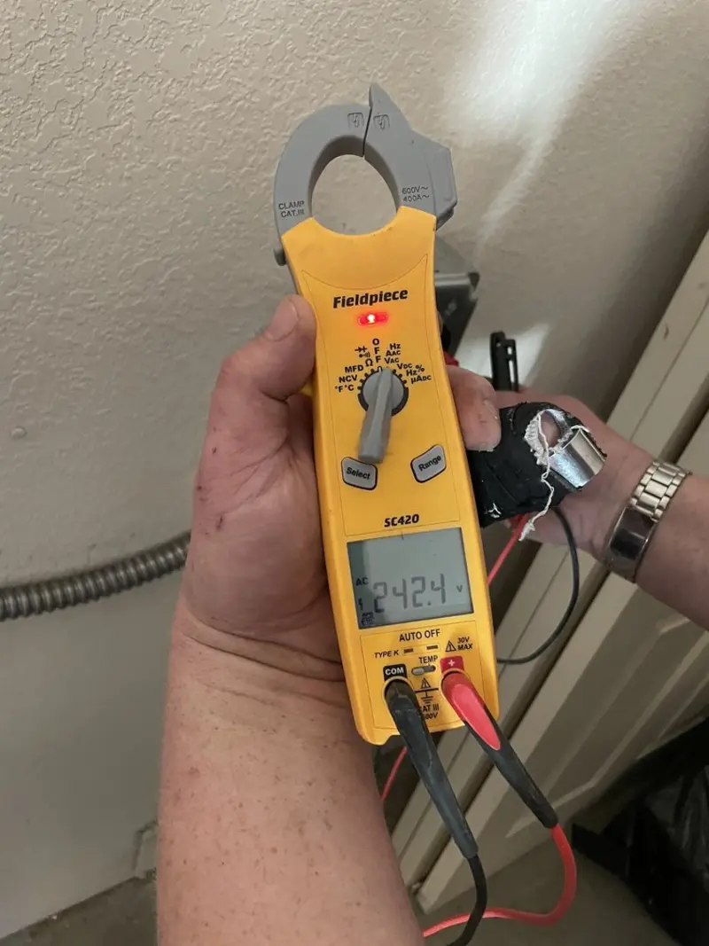 Voltage testing with clamp meter during Aluminum Wiring Replacement in Dumas
